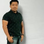 Japanese Man in Black Shirt and White Background